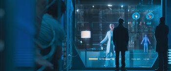 Movie still from “Maze Runner: The Scorch Trials” (2015), directed by Wes Ball – A man in a white lab coat standing in front of a window; Wide shot, Over the shoulder angle