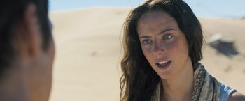 Movie still from “Maze Runner: The Scorch Trials” (2015), directed by Wes Ball – A person with long brown hair; Close Up shot, Over the shoulder angle