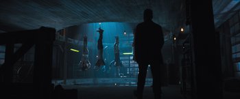 Movie still from “Maze Runner: The Scorch Trials” (2015), directed by Wes Ball – A group of people hanging upside - down in a room; Wide shot, Low angle