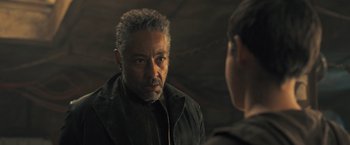 Movie still from “Maze Runner: The Scorch Trials” (2015), directed by Wes Ball – An older man in a black jacket talking to a younger man; Close Up shot, Over the shoulder angle