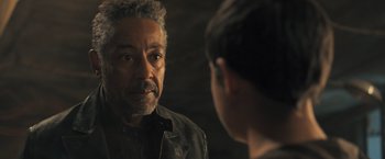 Movie still from “Maze Runner: The Scorch Trials” (2015), directed by Wes Ball – An older man looking at a younger man in the mirror; Close Up shot, Over the shoulder angle