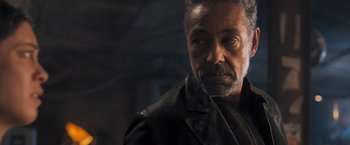 Movie still from “Maze Runner: The Scorch Trials” (2015), directed by Wes Ball – An older man wearing a leather jacket looking at the camera; Close Up shot, Low angle