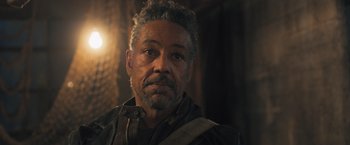 Movie still from “Maze Runner: The Scorch Trials” (2015), directed by Wes Ball – A person with a beard; Close Up shot, Over the shoulder angle