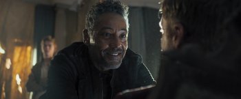 Movie still from “Maze Runner: The Scorch Trials” (2015), directed by Wes Ball – A person sitting at a table; Close Up shot, Over the shoulder angle