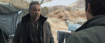 Movie still from “Maze Runner: The Scorch Trials” (2015), directed by Wes Ball – A man standing in the desert looking at the camera; Medium shot, Over the shoulder angle