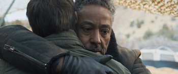 Movie still from “Maze Runner: The Scorch Trials” (2015), directed by Wes Ball – A man hugging another man in a forest; Close Up shot, Over the shoulder angle