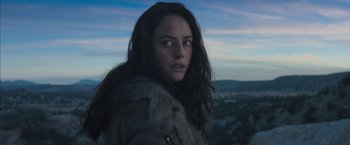 Movie still from “Maze Runner: The Scorch Trials” (2015), directed by Wes Ball – A woman with long black hair wearing a fur coat; Close Up shot, Low angle