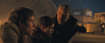 Movie still from “Maze Runner: The Scorch Trials” (2015), directed by Wes Ball – A group of people that are standing up; Close Up shot, Over the shoulder angle