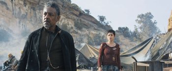 Movie still from “Maze Runner: The Scorch Trials” (2015), directed by Wes Ball – A man and a woman standing next to each other; Medium shot, Over the shoulder angle