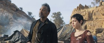 Movie still from “Maze Runner: The Scorch Trials” (2015), directed by Wes Ball – A man standing next to a woman on a beach; Medium shot, Low angle