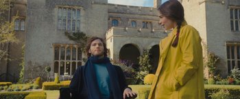 Movie still from “Me Before You” (2016), directed by Thea Sharrock – A man and a woman standing next to each other; Medium shot, Over the shoulder angle