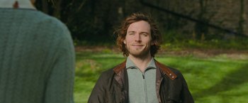 Movie still from “Me Before You” (2016), directed by Thea Sharrock – A person wearing a jacket; Close Up shot, Over the shoulder angle