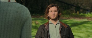 Movie still from “Me Before You” (2016), directed by Thea Sharrock – A person wearing a jacket; Close Up shot, Over the shoulder angle