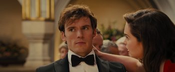 Movie still from “Me Before You” (2016), directed by Thea Sharrock – A man in a suit and a bow tie; Close Up shot, Over the shoulder angle