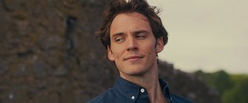 Movie still from “Me Before You” (2016), directed by Thea Sharrock – A person wearing a blue shirt; Close Up shot, Over the shoulder angle