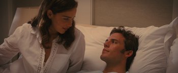 Movie still from “Me Before You” (2016), directed by Thea Sharrock – A man and a woman sitting in a bed; Medium shot, Overhead angle