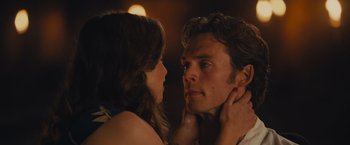 Movie still from “Me Before You” (2016), directed by Thea Sharrock – A man and a woman looking into each others eyes; Close Up shot, Over the shoulder angle