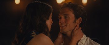 Movie still from “Me Before You” (2016), directed by Thea Sharrock – A man and a woman looking into each others eyes; Close Up shot, Over the shoulder angle