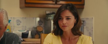 Movie still from “Me Before You” (2016), directed by Thea Sharrock – A person sitting in a chair; Close Up shot, Over the shoulder angle