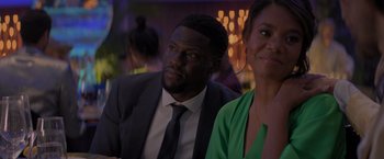 Movie still from “Me Time” (2022), directed by John Hamburg – A man and a woman sitting next to each other in a room; Close Up shot, Over the shoulder angle