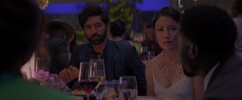 Movie still from “Me Time” (2022), directed by John Hamburg – A man and a woman sitting at a dinner table; Close Up shot, Over the shoulder angle