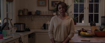 Movie still from “Me Time” (2022), directed by John Hamburg – A woman standing in a kitchen with her hands on her hips; Medium shot, Over the shoulder angle