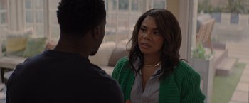 Movie still from “Me Time” (2022), directed by John Hamburg – A woman in a green sweater talking to a man; Close Up shot, Over the shoulder angle