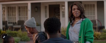 Movie still from “Me Time” (2022), directed by John Hamburg – A group of young people standing in front of a house; Medium shot, Over the shoulder angle