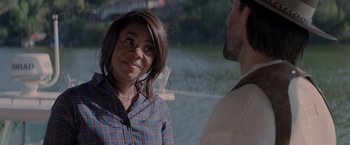 Movie still from “Me Time” (2022), directed by John Hamburg – A woman and a man are standing next to each other in front of a body of water; Close Up shot, Over the shoulder angle