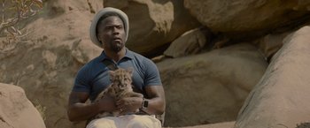 Movie still from “Me Time” (2022), directed by John Hamburg – A man holding a cat in his hands; Close Up shot, Over the shoulder angle