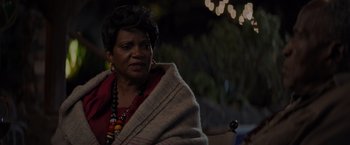 Movie still from “Me Time” (2022), directed by John Hamburg – An older woman wrapped in a blanket looking at the camera; Close Up shot, Over the shoulder angle