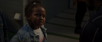Movie still from “Me Time” (2022), directed by John Hamburg – A little girl is standing in the dark; Close Up shot, High angle