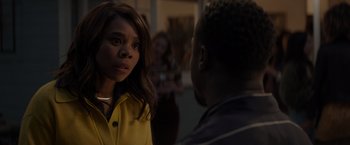 Movie still from “Me Time” (2022), directed by John Hamburg – A woman in a yellow jacket talking to a man in a black jacket; Close Up shot, Over the shoulder angle