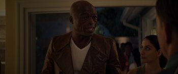 Movie still from “Me Time” (2022), directed by John Hamburg – A person wearing a leather jacket; Close Up shot, Over the shoulder angle