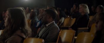 Movie still from “Me Time” (2022), directed by John Hamburg – A group of people sitting in a room; Medium shot, Over the shoulder angle