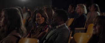 Movie still from “Me Time” (2022), directed by John Hamburg – A man and a woman sitting next to each other in a room; Medium shot, Over the shoulder angle