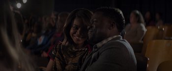 Movie still from “Me Time” (2022), directed by John Hamburg – A man and a woman smiling for the camera; Close Up shot, Over the shoulder angle