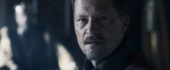 Movie still from “Medieval” (2022), directed by Petr Jákl – A person with a beard; Close Up shot, Over the shoulder angle