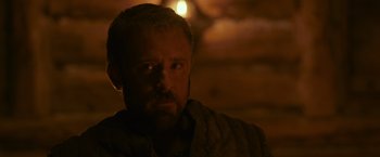 Movie still from “Medieval” (2022), directed by Petr Jákl – A person with a beard; Close Up shot, Over the shoulder angle