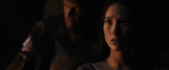 Movie still from “Medieval” (2022), directed by Petr Jákl – A young woman with dirt all over her face; Close Up shot, Over the shoulder angle