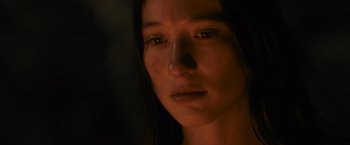 Movie still from “Medieval” (2022), directed by Petr Jákl – A woman's face in the dark; Close Up shot, Low angle