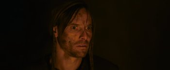 Movie still from “Medieval” (2022), directed by Petr Jákl – A person with long dreadlocks; Close Up shot, Low angle