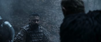 Movie still from “Medieval” (2022), directed by Petr Jákl – A man in a black jacket and a man in a black jacket; Medium shot, Over the shoulder angle