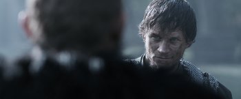 Movie still from “Medieval” (2022), directed by Petr Jákl – A person with a beard; Close Up shot, Over the shoulder angle