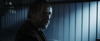 Movie still from “Medieval” (2022), directed by Petr Jákl – A person with long hair and a beard; Close Up shot, Low angle