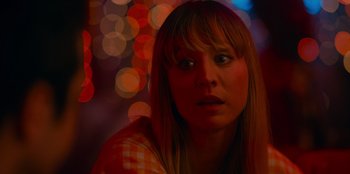 Movie still from “Meet Cute” (2022), directed by Alex Lehmann – A woman with bangs is looking at the camera; Close Up shot, Over the shoulder angle