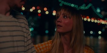 Movie still from “Meet Cute” (2022), directed by Alex Lehmann – A woman looking up into the sky at night; Close Up shot, Over the shoulder angle