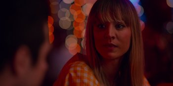 Movie still from “Meet Cute” (2022), directed by Alex Lehmann – A person wearing a checkered shirt; Close Up shot, Over the shoulder angle