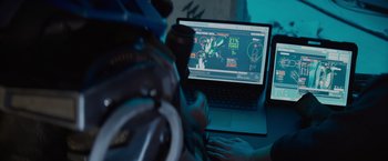 A person sitting in front of a laptop computer