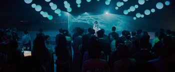 Movie still from “Meg 2: The Trench” (2023), directed by Ben Wheatley – A group of people standing in front of an audience; Extreme Wide shot, Low angle